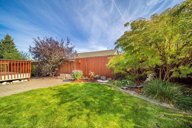 view of yard featuring a deck