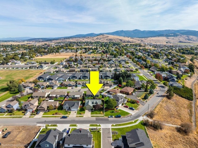 birds eye view of property featuring a mountain view