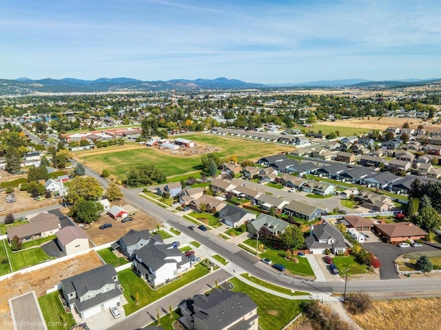 birds eye view of property with a mountain view