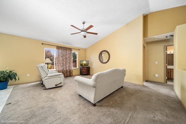 living room with lofted ceiling, carpet floors, a textured ceiling, and ceiling fan