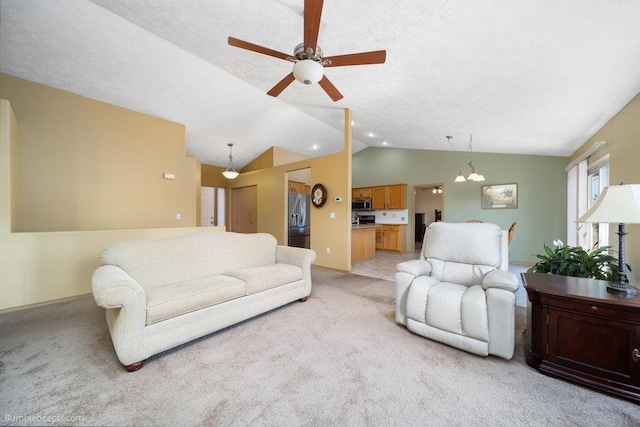 carpeted living room featuring lofted ceiling, ceiling fan with notable chandelier, and a textured ceiling