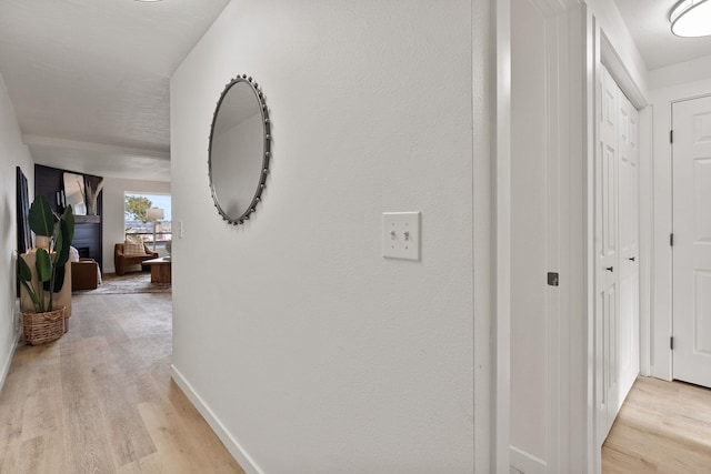 corridor featuring light hardwood / wood-style flooring