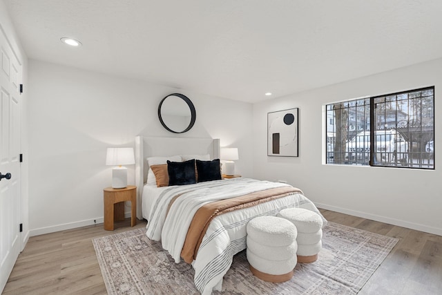 bedroom with light wood-type flooring