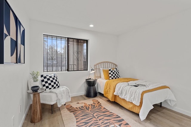 bedroom with hardwood / wood-style flooring