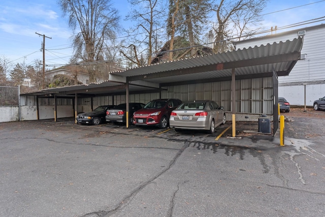 view of parking / parking lot with a carport