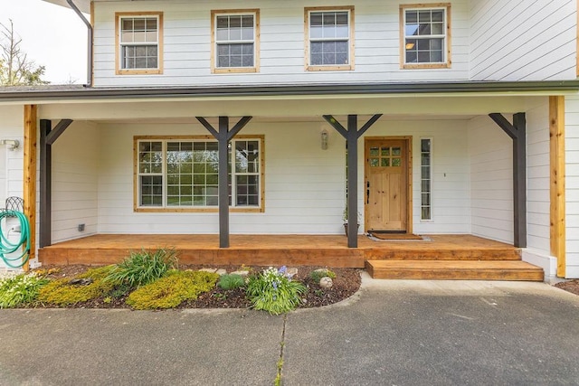 doorway to property featuring a porch