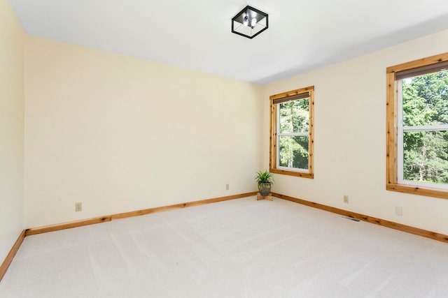 empty room featuring carpet flooring