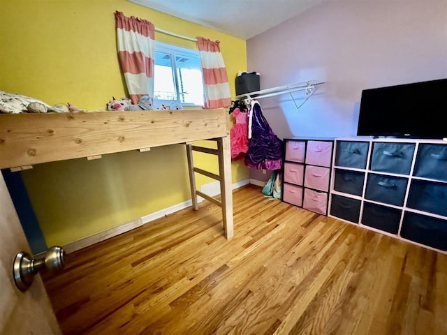 unfurnished bedroom featuring wood-type flooring