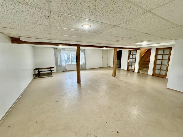 basement featuring a paneled ceiling