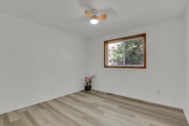 spare room with light hardwood / wood-style flooring and ceiling fan