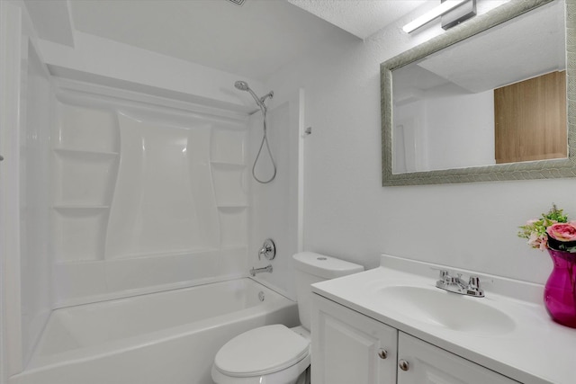 full bathroom featuring washtub / shower combination, vanity, and toilet