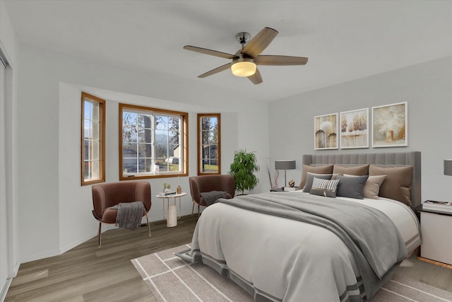 bedroom with hardwood / wood-style flooring and ceiling fan