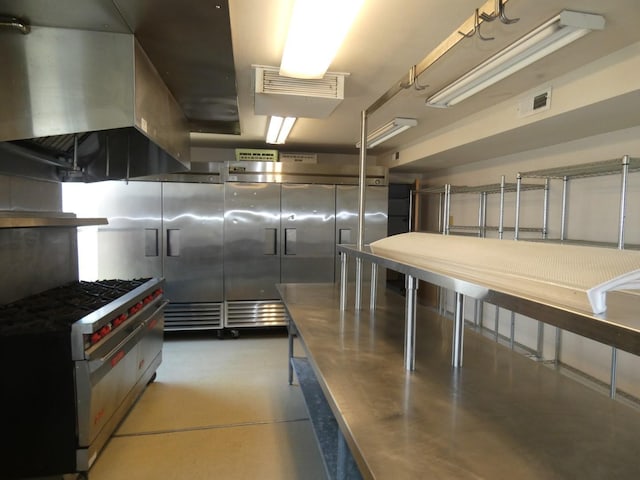 706 2nd St, Cheney, WA 99004 - kitchen featuring concrete flooring, exhaust hood, and stainless steel range