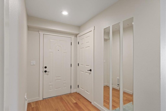 doorway to outside featuring wood-type flooring