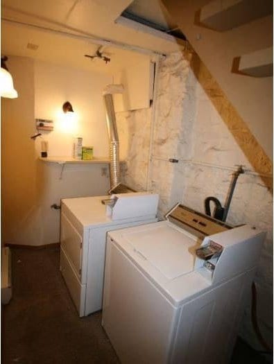 laundry area with independent washer and dryer