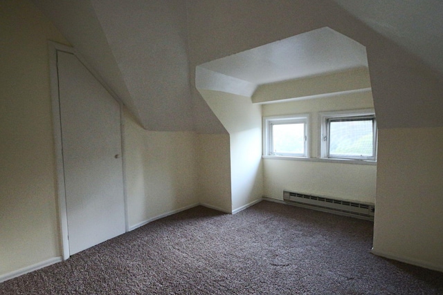 bonus room featuring carpet, a baseboard heating unit, and lofted ceiling