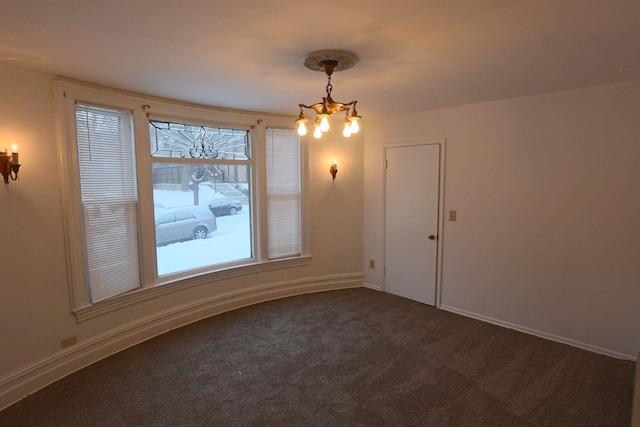 unfurnished dining area with carpet flooring and an inviting chandelier