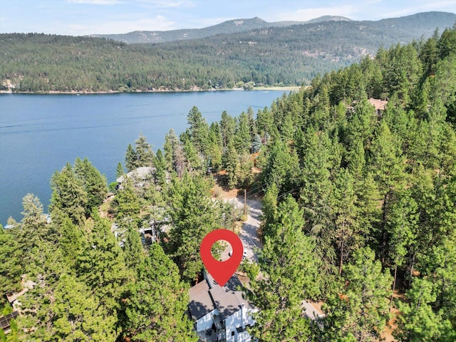 aerial view featuring a water and mountain view