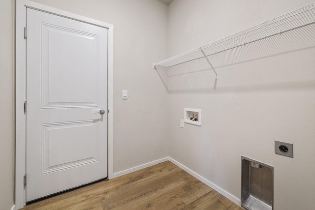 washroom featuring hardwood / wood-style flooring, hookup for a washing machine, and electric dryer hookup