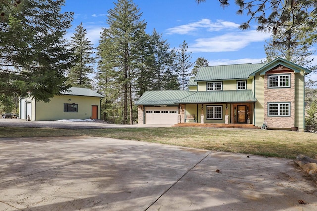 view of front facade featuring a garage and a front lawn