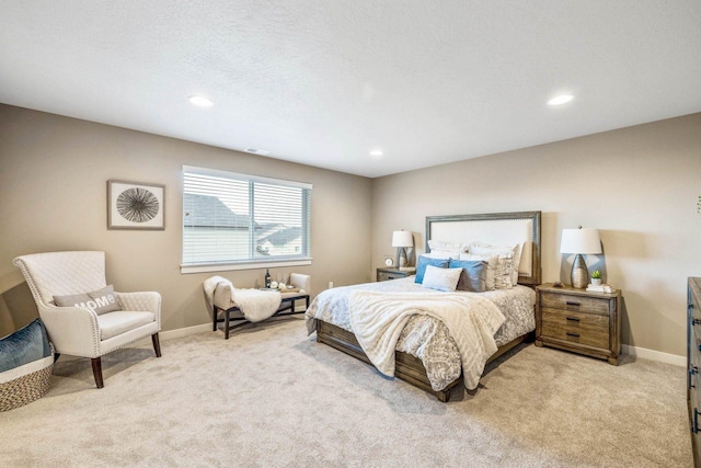 carpeted bedroom with a textured ceiling