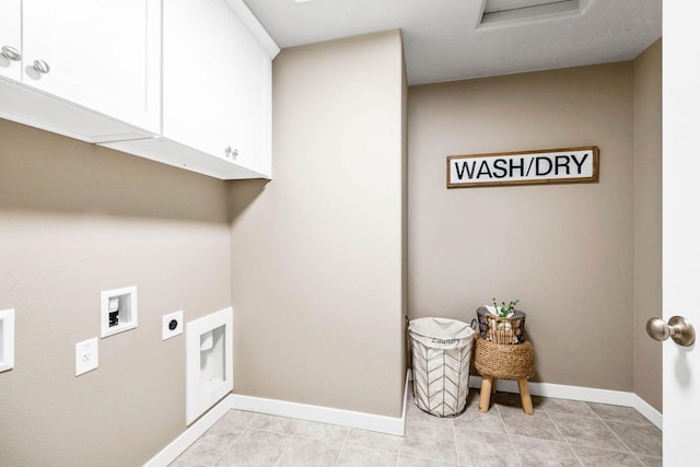 laundry area featuring cabinets, hookup for an electric dryer, hookup for a washing machine, and light tile patterned floors