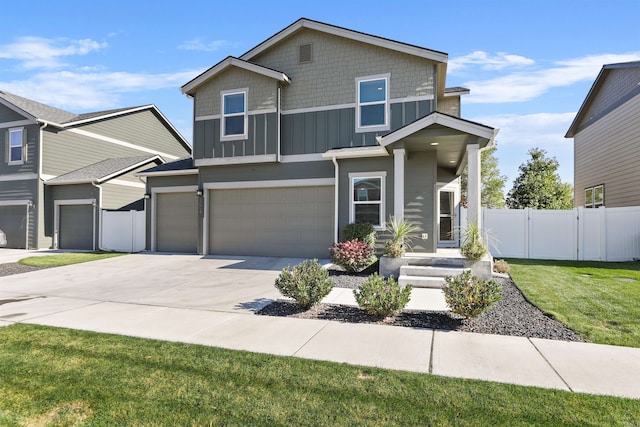 view of front of house featuring a garage and a front yard