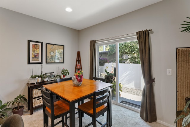 view of carpeted dining area