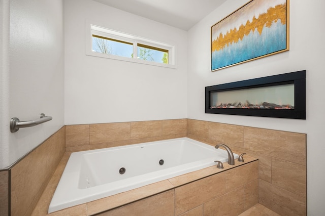 bathroom featuring tiled tub