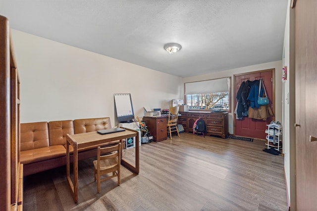 office featuring hardwood / wood-style flooring and a textured ceiling