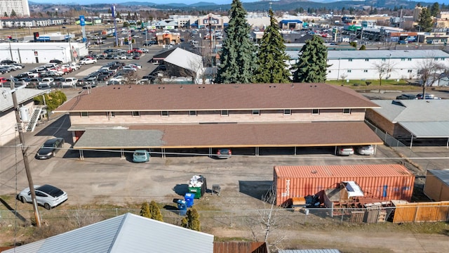 birds eye view of property featuring a mountain view