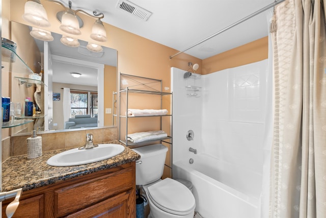 full bathroom featuring vanity, shower / tub combo, and toilet