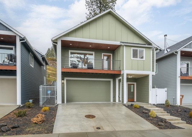 view of front of house featuring a garage and a balcony