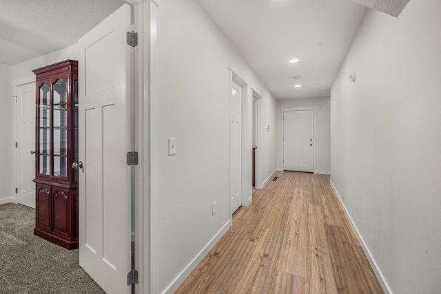 hallway with light wood-type flooring