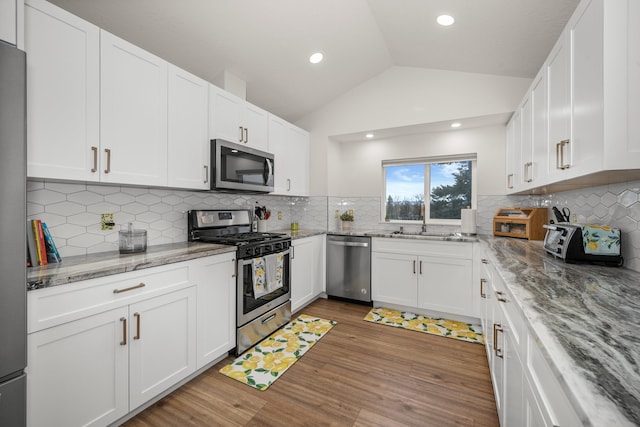 kitchen featuring appliances with stainless steel finishes and white cabinets