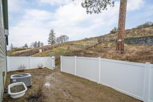 view of yard featuring central AC unit