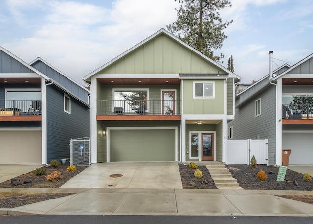 view of front of home featuring a garage and a balcony