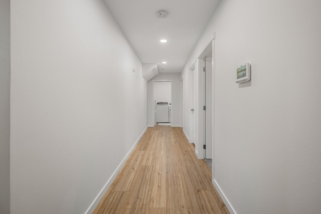 hall with light wood-type flooring