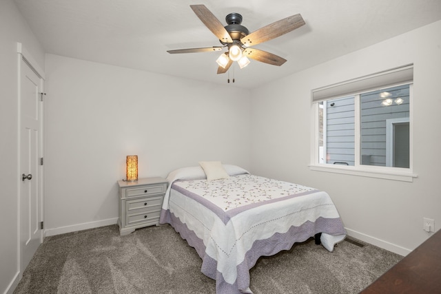 bedroom featuring ceiling fan and dark colored carpet