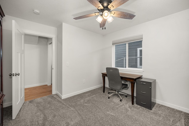 carpeted office with ceiling fan