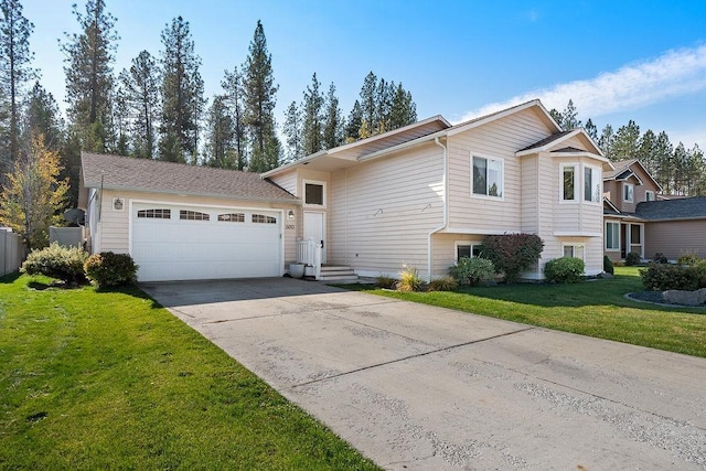 view of front of property featuring a garage and a front lawn