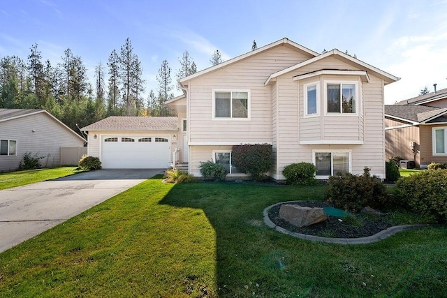 view of front of property with a garage and a front yard