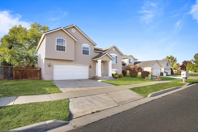 view of front of home featuring a garage and a front yard