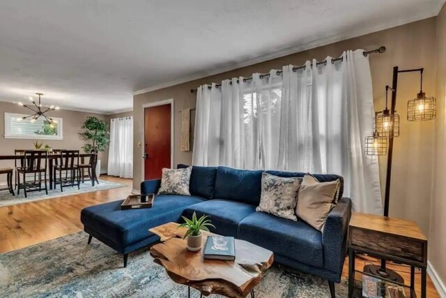 living room featuring hardwood / wood-style floors and a notable chandelier