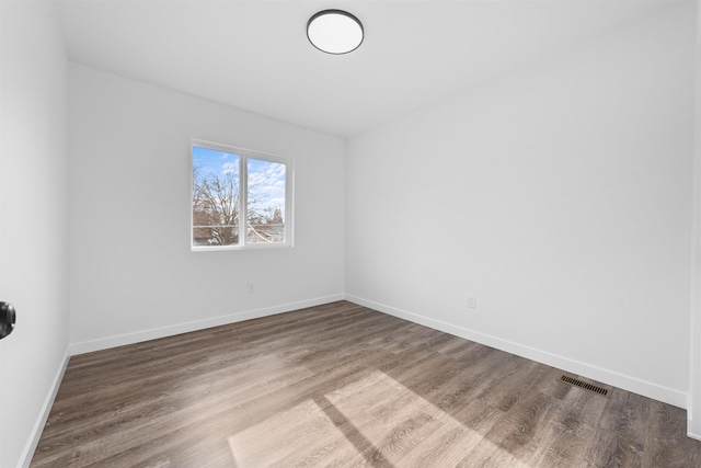 empty room featuring hardwood / wood-style flooring