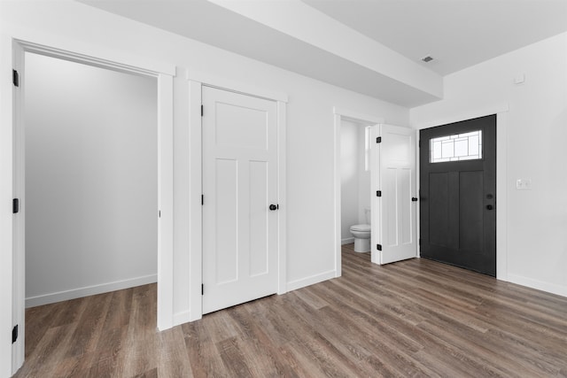 foyer featuring dark wood-type flooring