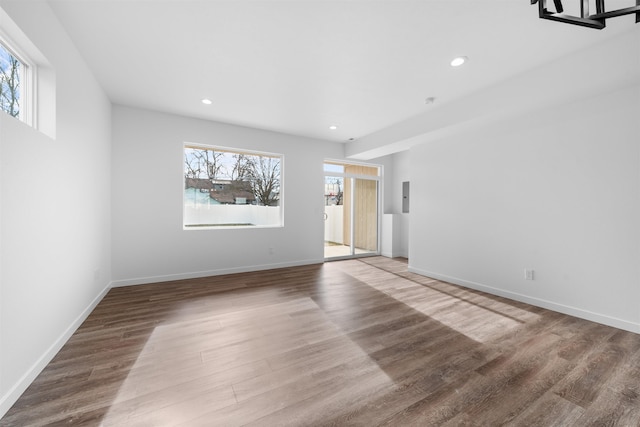 empty room with hardwood / wood-style floors