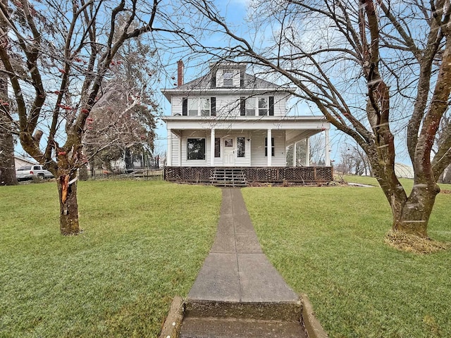 view of front of house with a front lawn and a porch