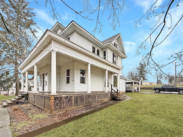 view of front of house with a front yard and covered porch