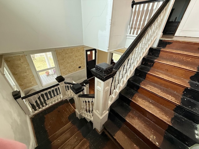 staircase featuring wood-type flooring